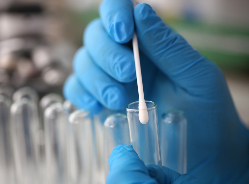 Forensic,Scientist,Conducting,Criminal,Investigation,Aganist,Laboratory,Background.,Holds,Cotton