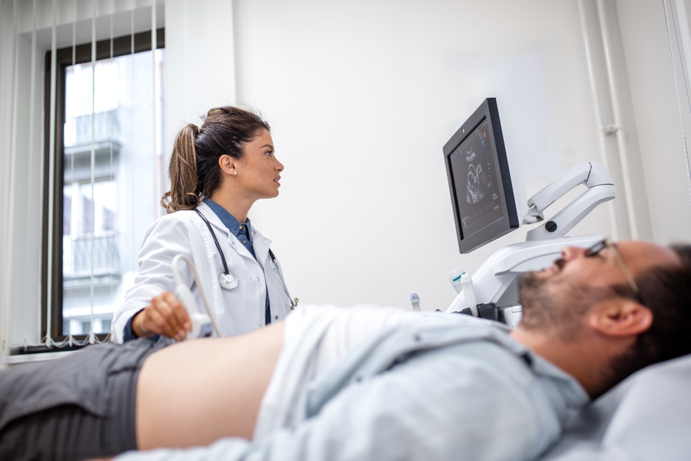 A,Female,Doctor,Performs,An,Abdominal,Ultrasound,On,A,Male
